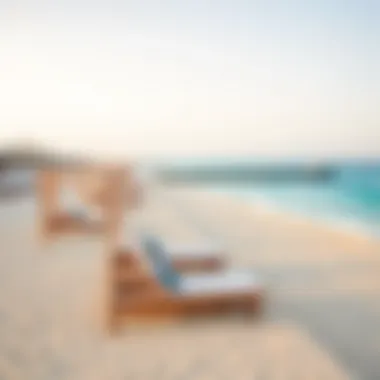 Stunning beachfront in Dubai with sun loungers and clear blue waters.